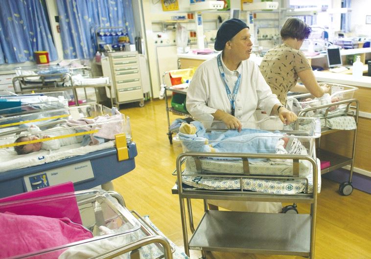 NURSES TAKE CARE of newborn infants at a nursery in Hadassah-University Medical Center in Jerusalem’s Ein Kerem.