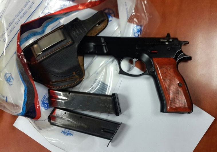 The gun and cartridges seized by police.