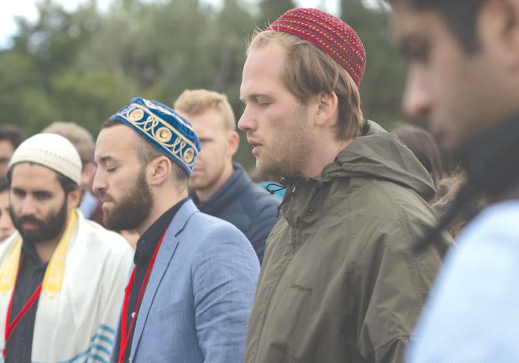 PARTICIPANTS IN THE Muslim Jewish Conference take part in interfaith prayer last week at the site of the Sachsenhasuen concentration camp in Oranienburg, Germany