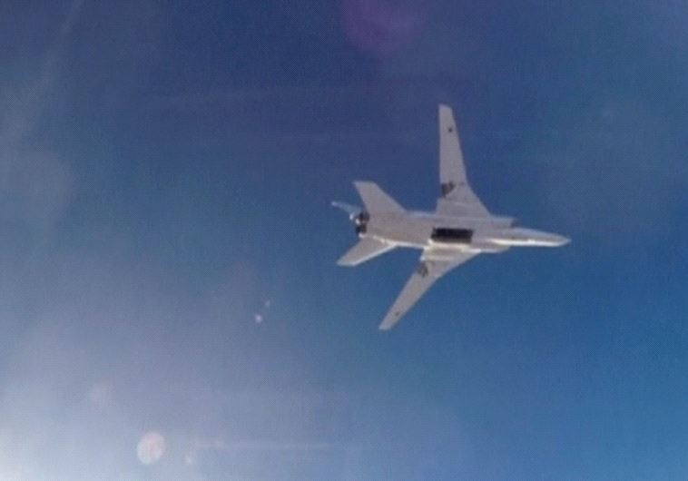 A STILL IMAGE taken from video shows a Russian Tupolev Tu-22M3 long-range bomber based in Iran flying over an unknown location in Syria on Tuesday after dropping its payload.