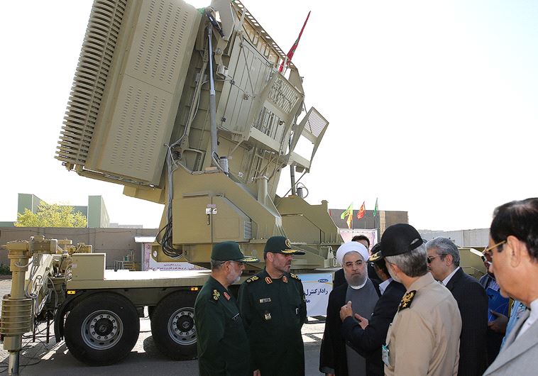 Iran's President Hassan Rouhani (3rd L) and Iranian Defence Minister Hossein Dehghan (2nd L) stand in front of the new air defense missile system Bavar-373, in Tehran, Iran August 21, 2016