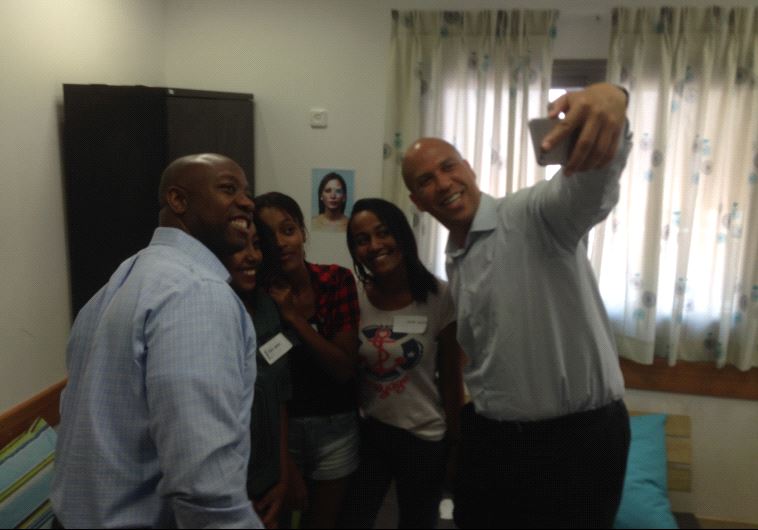 Senator Cory Booker and Tim Scott take a selfe with Ramla youth.