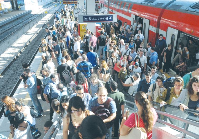 FRUSTRATED PASSENGERS fill platforms 5 and 6 at the Savidor central train station in Tel Aviv. 