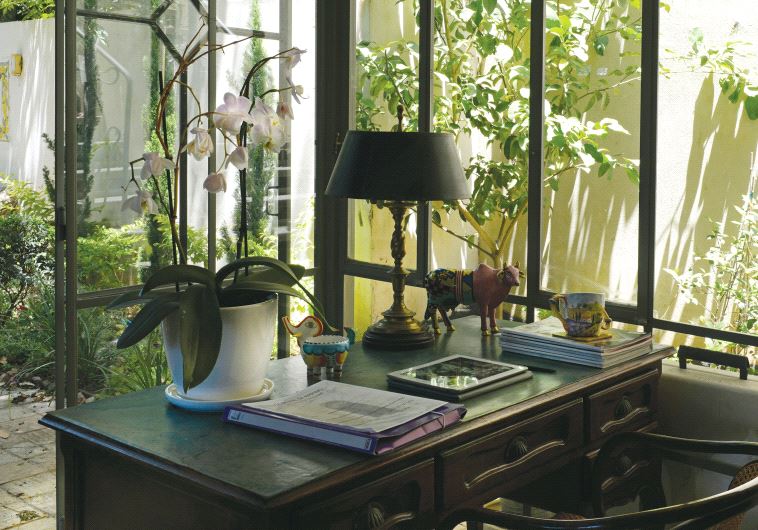 KIM LINDY’S antique mahogany desk in her home in Ramat Hasharon.