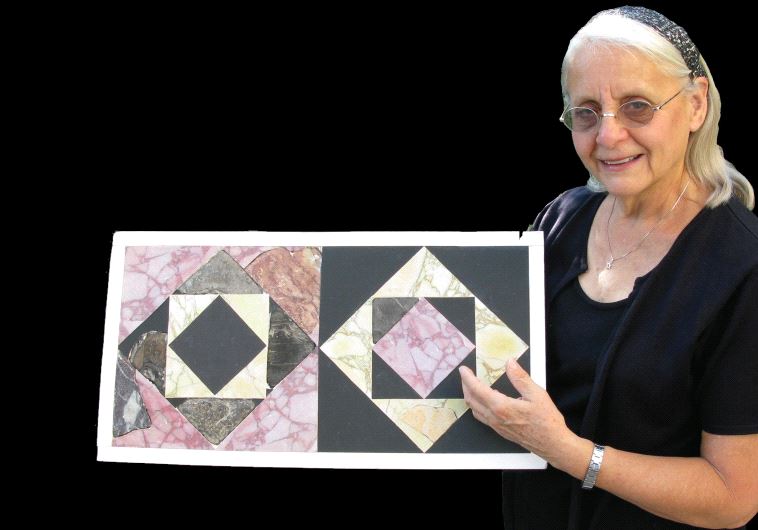 Frankie Snyder holds up an ‘opus sectile’ tile