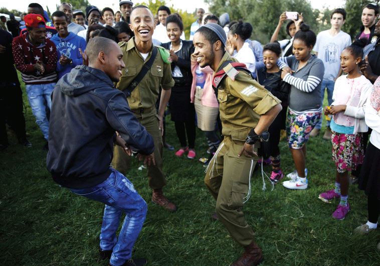 Members of the Ethiopian Jewish community in Israel dance during a ceremony marking the holiday of Sigd