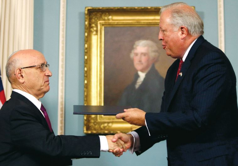 US Undersecretary of State Tom Shannon (R) and Israeli Acting National Security Advisor Jacob Nagel (L) shake hands after participating in a signing ceremony for a new ten year pact on security assistance between the two countries, in Washington