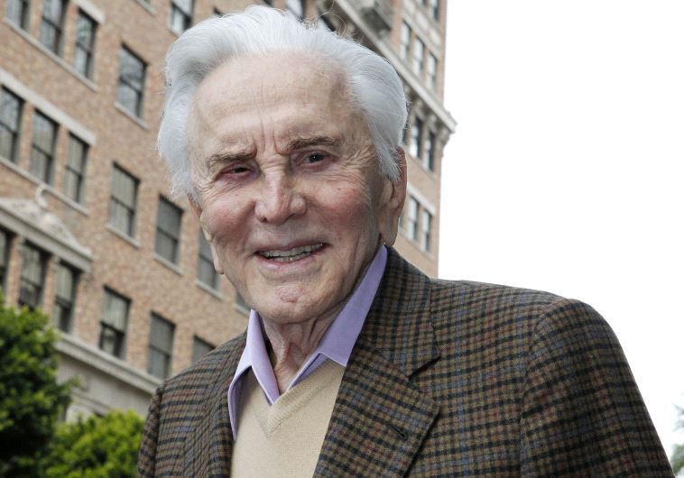 Actor Kirk Douglas poses during ceremonies unveiling international orchestral and operatic conductor Zubin Mehta on the Hollywood Walk of Fame in Hollywood, California March 1, 2011. 