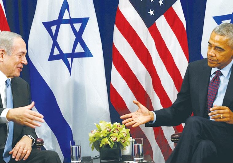A SMILING Prime Minister Benjamin Netanyahu reaches out to shake the hand of an aloof President Barack Obama during their meeting Wednesday in New York.