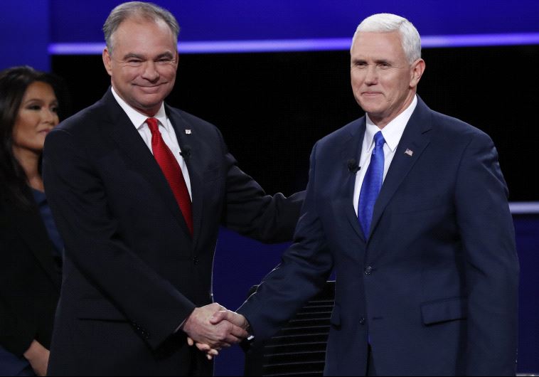 Democratic US vice presidential nominee Senator Tim Kaine shakes hands with Republican US vice presidential nominee Governor Mike Pence (R)
