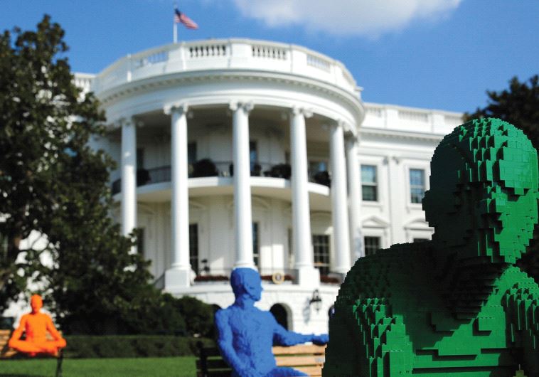 BUILDING BLOCKS of the next US policy in the Middle East? LEGO statues on park benches in the South Lawn of the White House in Washington DC.
