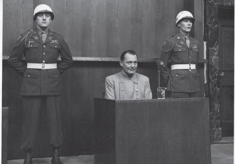 Hermann Goering, pictured at the 1945 Nuremberg Trials, was described by an American warden as a ‘simpering slob’
