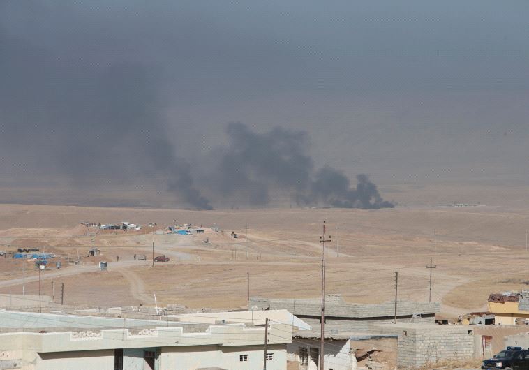 Smoke rises from clashes in the east of Mosul during clashes with Islamic State militants in Mosul, Iraq, October 17, 2016