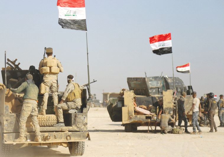 IRAQI FORCES advance in Qayara to attack Islamic State in Mosul