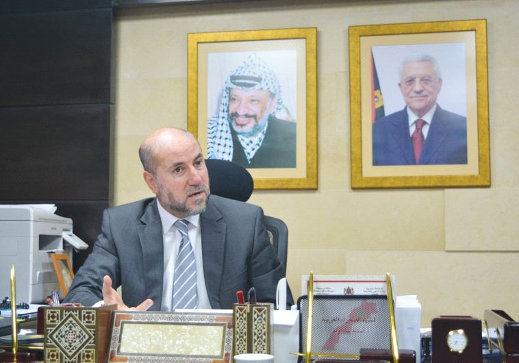 MAHMOUD AL-HABASH, top adviser to PA President Mahmoud Abbas, responds to questions during an interview yesterday in his office in northern Ramallah.
