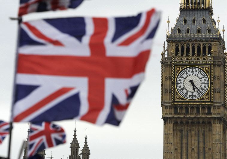Flags are seen above a souvenir kiosk near Big Ben clock at the Houses of Parliament in central London