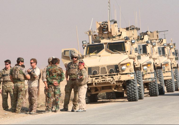 US military vehicles are seen north of Mosul during an operation against Islamic State in late October