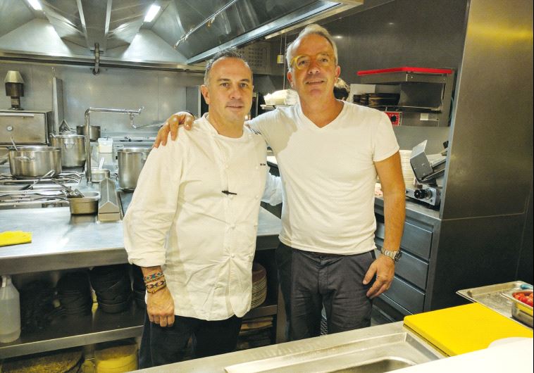 The writer (right), with Chef Miki Calzad in his restaurant in Barcelona