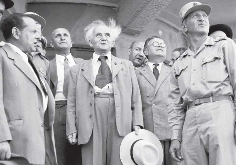 Then-Prime Minister David Ben- Gurion (center) watches the plane coming in carrying Theodor Herzl’s coffin at Lod airport, on August 16, 1949