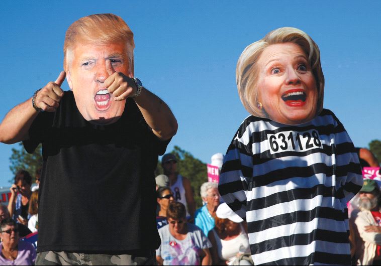 PEOPLE DRESS UP as US presidential nominees Donald Trump and Hillary Clinton at a Trump campaign rally in Naples, Florida on October 23.