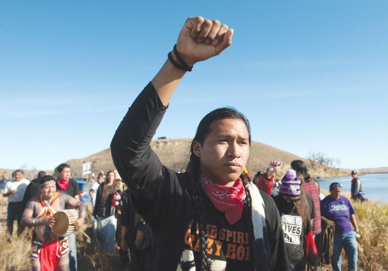 PROTESTERS DEMONSTRATE against the building of a pipeline on the Standing Rock Indian Reservation in North Dakota on Thursday.