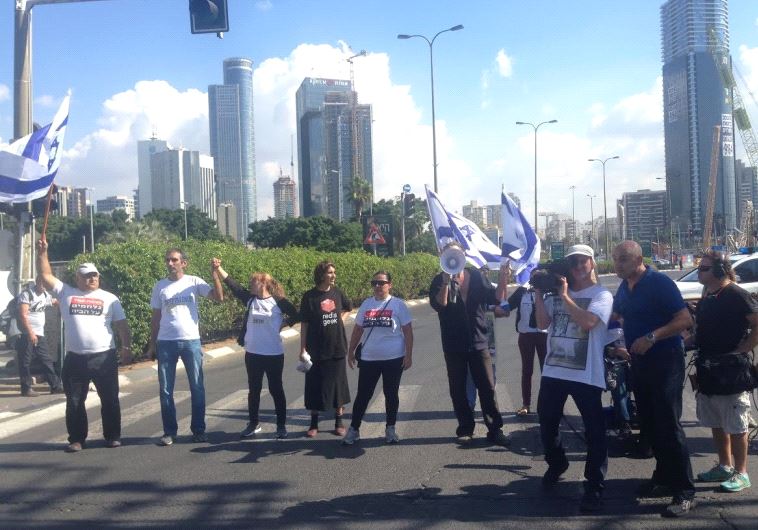 Vicki Knafo (third from left) leads a march of handicapped and financially disadvantaged persons in Tel Aviv on Sunday. 