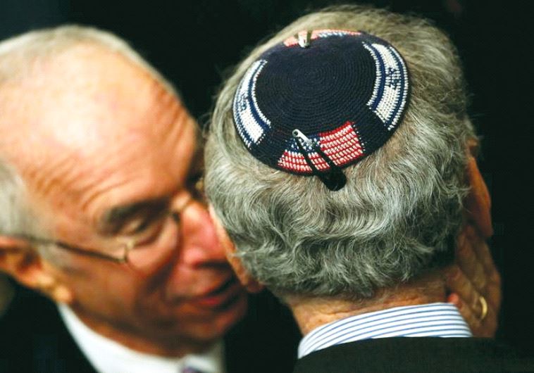 An American Jew wearing a kippa embroidered with the US and Israeli flags attends a Hanukka reception at the White House last year