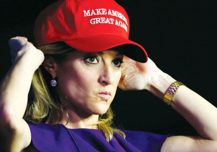 A Trump supporter adjusts her hat as she waits at President-elect Donald Trump’s election-night rally in Manhattan