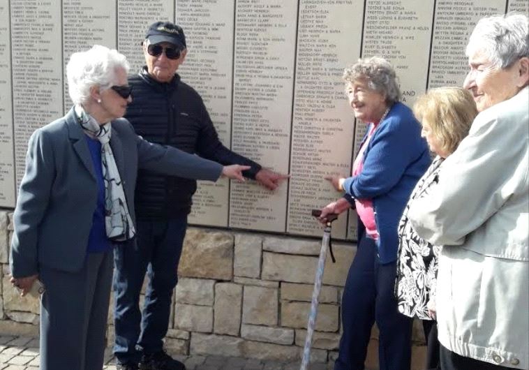 SS. St Louis survivors point to Captain Gustav Schröder's name on the Wall of Honor in the Garden of the Righteous Among the Nations 