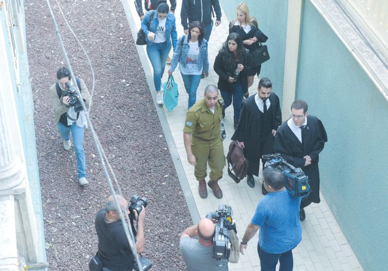 SGT. ELOR AZARIA (in uniform) arrives at the Jaffa Military Court
