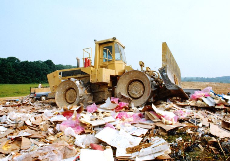 Bulldozer at garbage dump