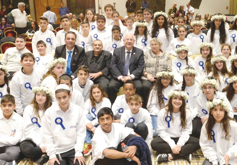 PRESIDENT REUVEN RIVLIN and his wife, Nechama, (center) host victims of terrorism who were celebrating their bnei mitzva last night.
