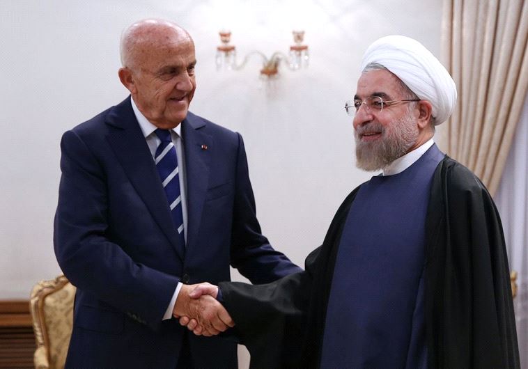 Iranian President Hassan Rouhani greeting Lebanese Defense Minister Samir Moqbel (L) at the presidential office in Tehran 