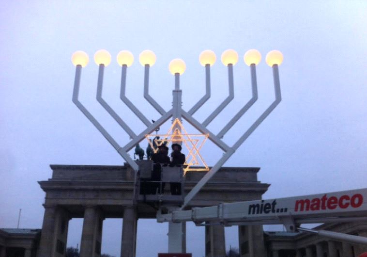 Rabbi Teichtel testing out menorah lighting in Berlin