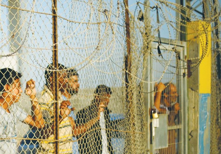 PALESTINIANS wait in October at the Rafah border crossing for relatives to return to Gaza from Egypt, during a temporary easing of the Egypt blockade for humanitarian cases.