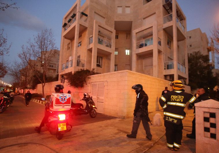 Emergency services outside the Jerusalem aparment building where a mother and four children died in an apartment fire on Jan 1 2017.