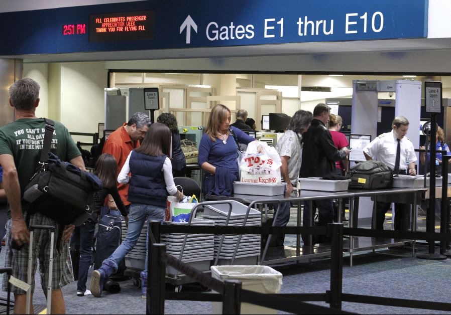 Passengers line up at a security checkpoint operated by the Transportation Security Administration (TSA) at Fort Lauderdale-Hollywood International Airport in Fort Lauderdale, Florida November 23, 2010.
