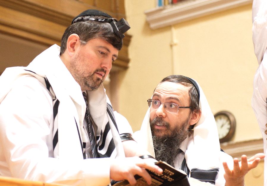 Former far-right politician Csanád Szegedi at prayer with Rabbi Baruch Oberlander, head of Chabad’s mission in Budapest