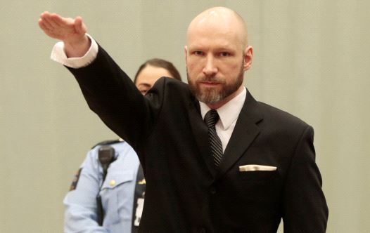 Anders Behring Breivik raises his right hand during the appeal case in Borgarting Court of Appeal at Telemark prison in Skien