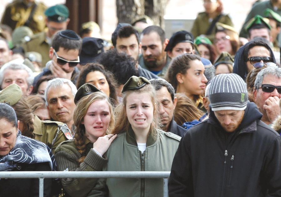 RELATIVES AND FRIENDS mourn during the funeral of IDF soldier Lt. Yael Yekutiel, who was killed on Sunday in the Jerusalem truck-ramming attack by a Palestinian terrorist
