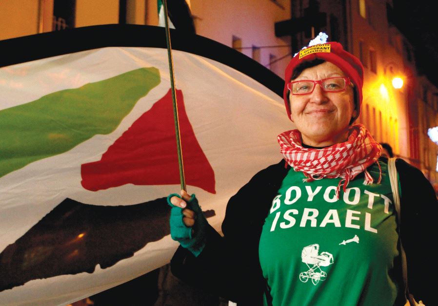 A WOMAN wearing a T-shirt that reads ‘Boycott Israel’ takes part in a pro-Palestinian demonstration in Brussels in 2011.