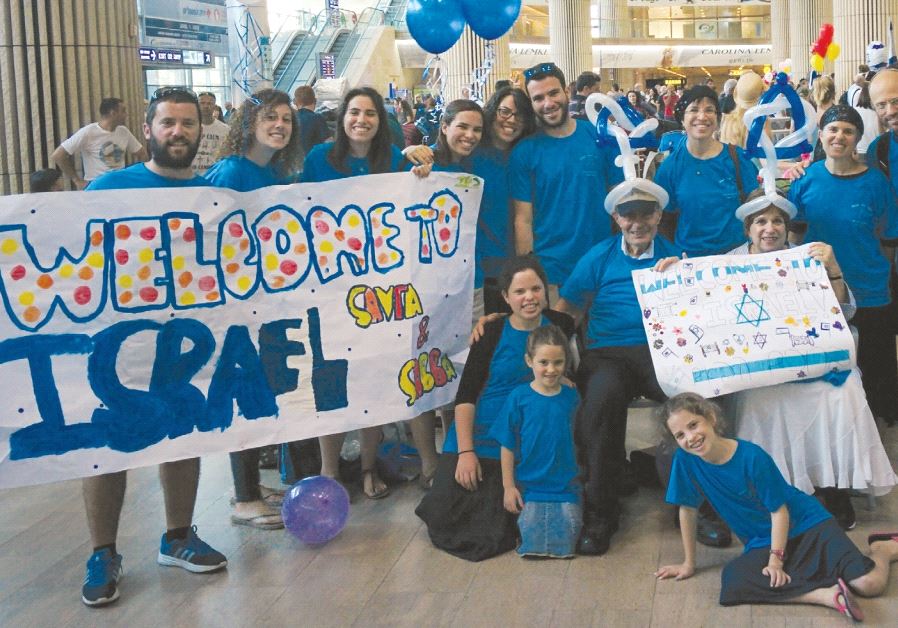 The Schwartzes are greeted at Ben-Gurion Airport by their two daughters’ families in August
