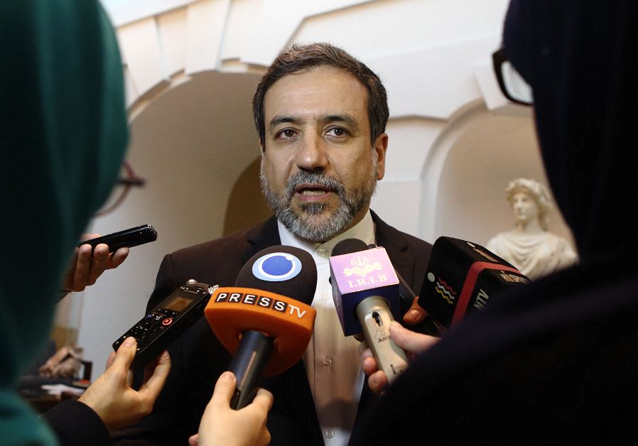 Iran's top nuclear negotiator Abbas Araqchi talks to journalists after meeting senior officials from the United States, Russia, China, Britain, Germany and France in a hotel in Vienna, Austria, October 19, 2015. 
