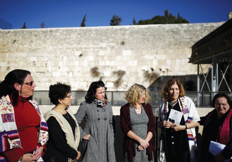 MEMBERS OF 'Women of the Wall' including the author (second from right) speak to the media following the Israeli government's decision last year
