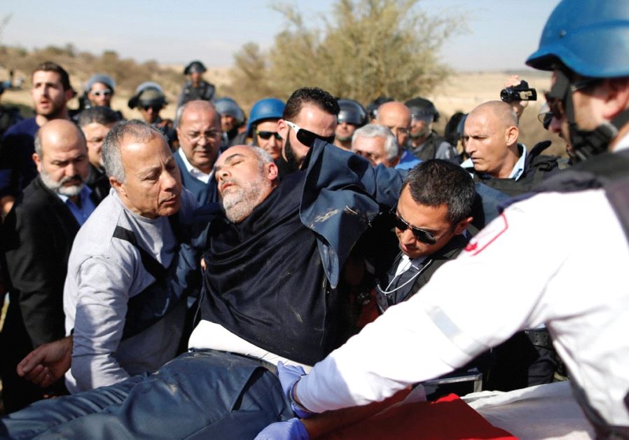 MEDICS EVACUATE MK Osama Sa’adi (Joint List) during a clash between riot police and Arab citizens in Umm al-Hiran