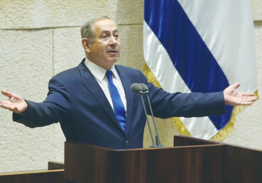 PRIME MINISTER Benjamin Netanyahu speaks during question time at the Knesset yesterday