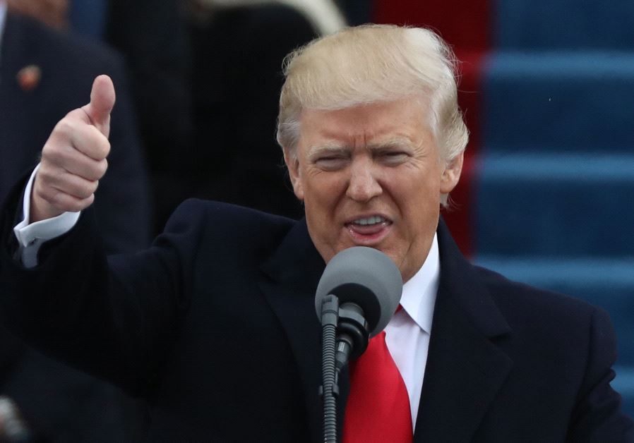 Newly inaugurated US President Donald Trump gives a thumbs up as he begins his inaugural address during ceremonies swearing him in as the 45th president of the United States on the West front of the U.S. Capitol in Washington, U.S., January 20, 2017