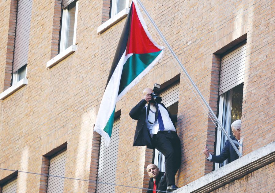 PALESTINIAN AUTHORITY PRESIDENT Mahmoud Abbas looks out a window during the inauguration ceremony of the Palestinian Embassy to the Holy See at the Vatican two weeks ago