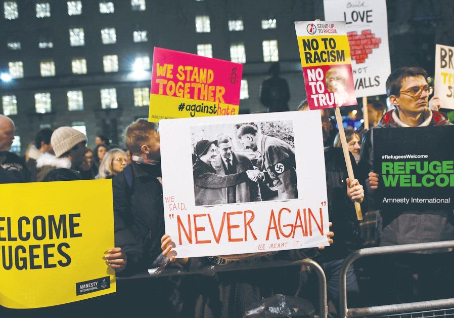 DEMONSTRATORS IN LONDON hold a protest rally yesterday against US President Donald Trump’s executive order banning refugees from seven Muslim countries from entering the US