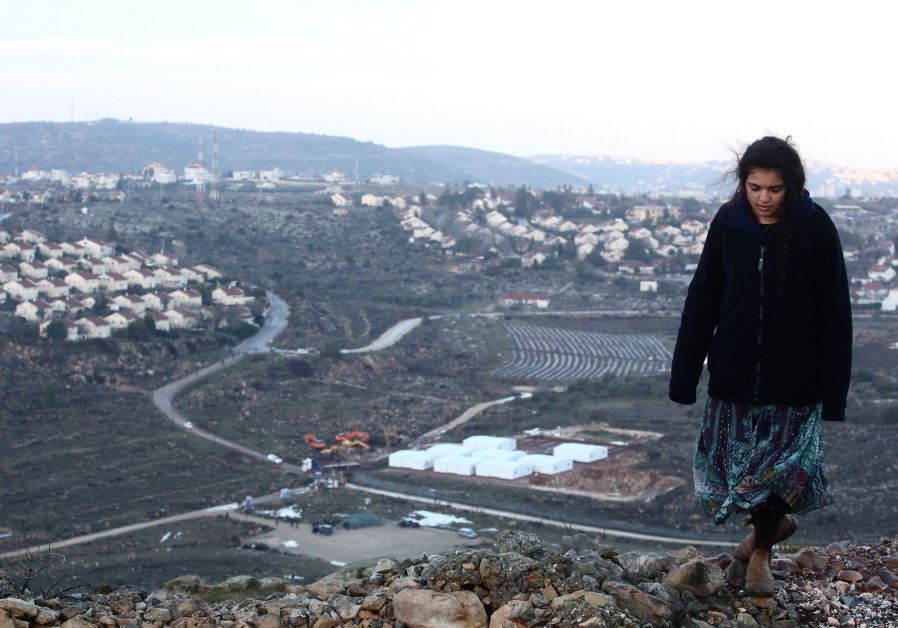 Amona resident with Ofra background